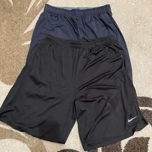 TWO PAIRS OF NIKE DRI FIR SHORTS
